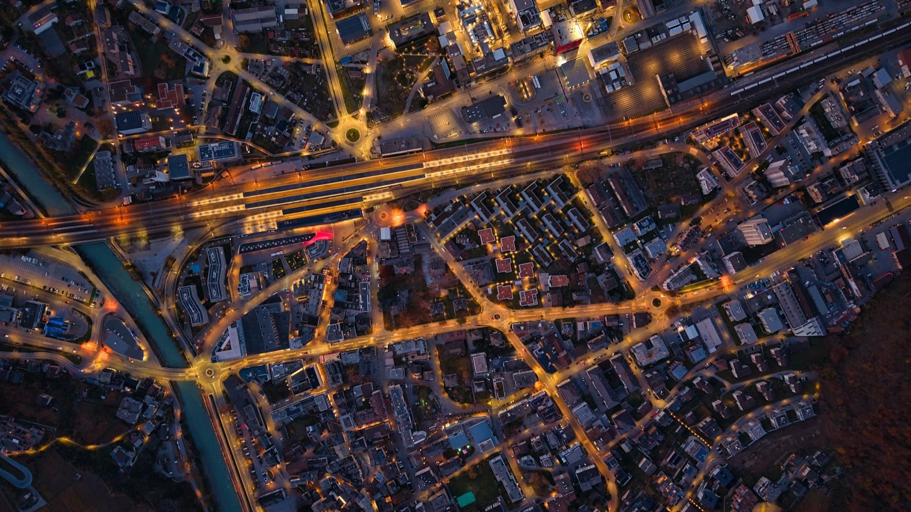 Aerial view of a city at night with illuminated streets